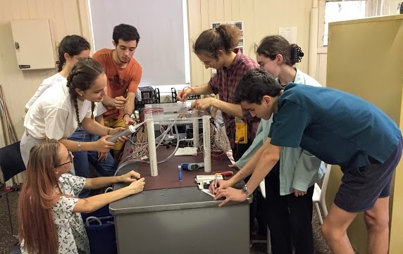 image of students testing cloud chamber for water leaks