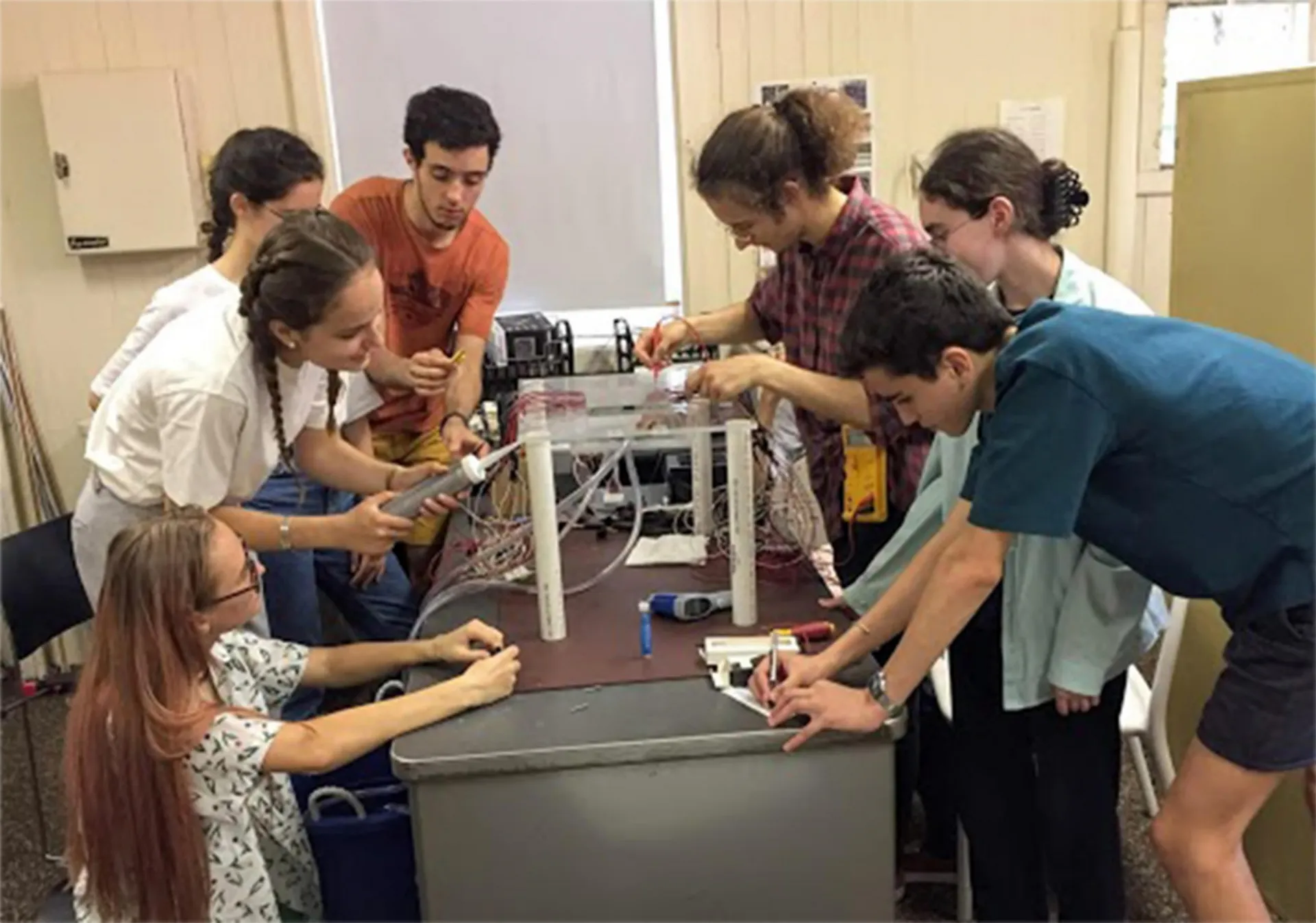 Tours and Barnard students testing for water leaks in the Cloud Chamber